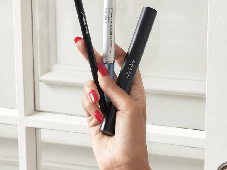 Image of hand holding 3 lash products